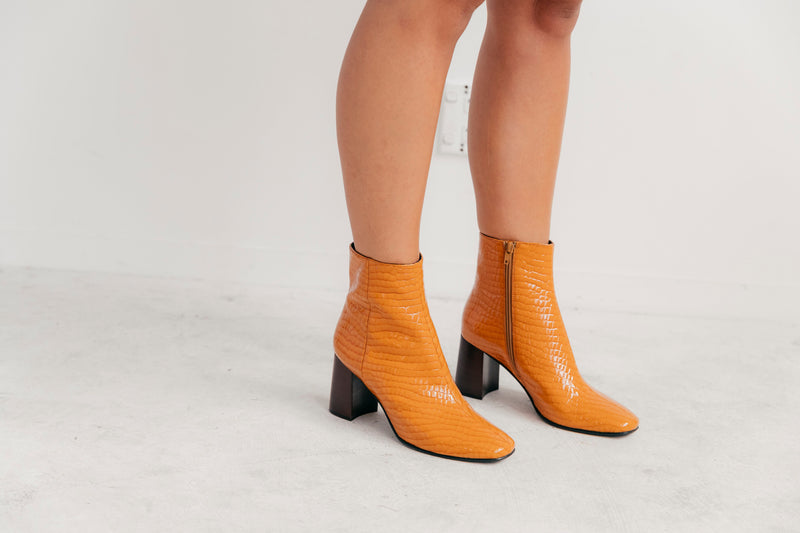 Orange crocodile ankle boot heels