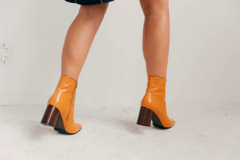 Orange crocodile ankle boot heels